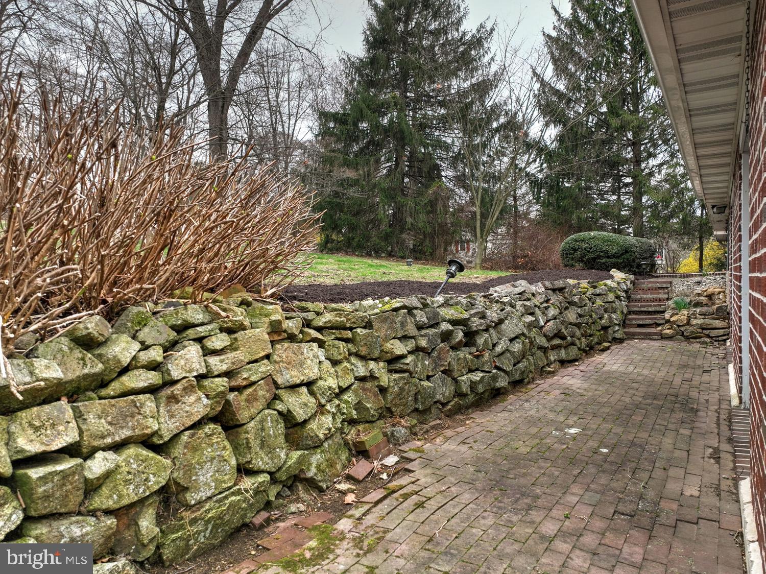 1822 Little Conestoga Road Elverson, PA 19520 - Photo 7 of 30 a view of a yard with yellow plants