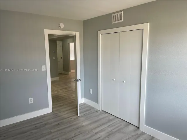 an empty room and wooden door