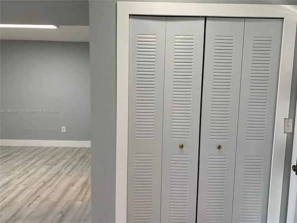 a view of a room with a white door