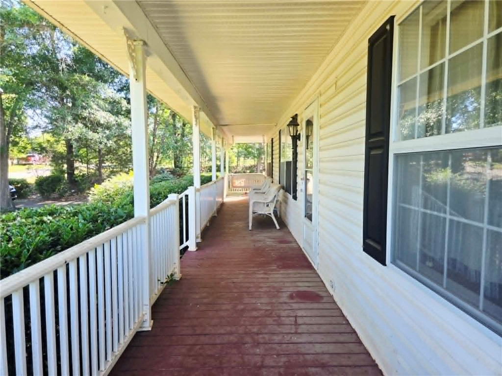 202 Keith Lane Seneca, SC 29678 - Photo 5 of 23 A deep covered porch provides a tranquil outdoor living space.