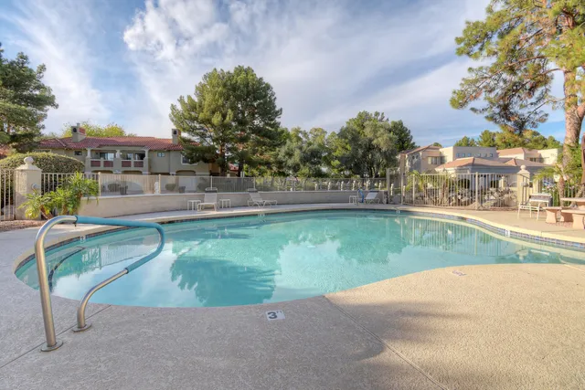 a view of a swimming pool and a yard