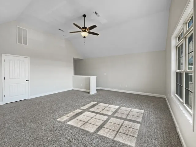 a view of an empty room and workspace