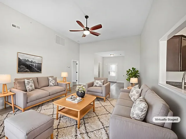 a living room with furniture and a large window