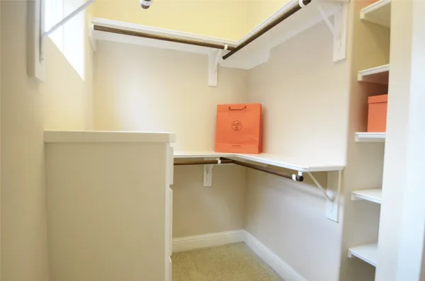 a bathroom with a granite countertop shower and a toilet