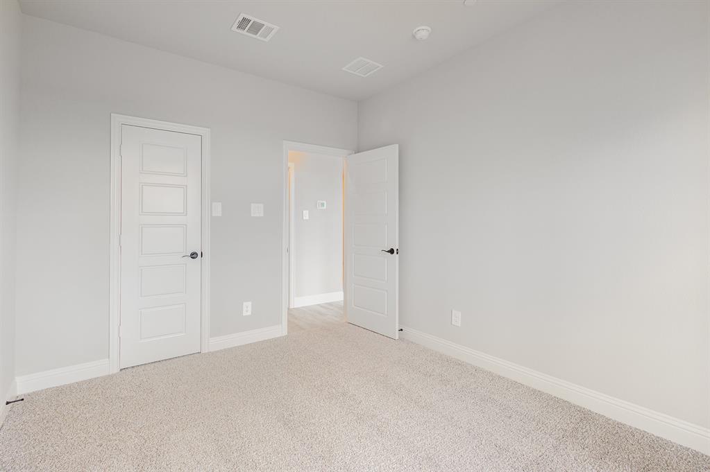 3613 Geoffrey Trail Rowlett, TX 75088 - Photo 11 of 13 Unfurnished bedroom featuring baseboards and carpet floors