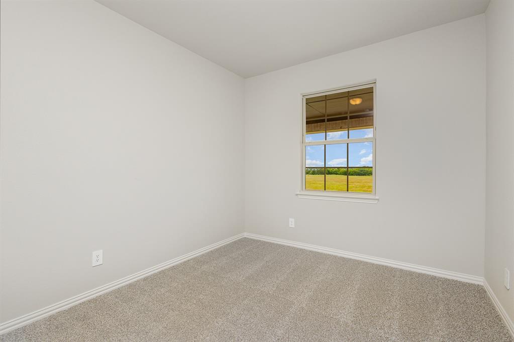 3613 Geoffrey Trail Rowlett, TX 75088 - Photo 12 of 13 Spare room featuring carpet and baseboards