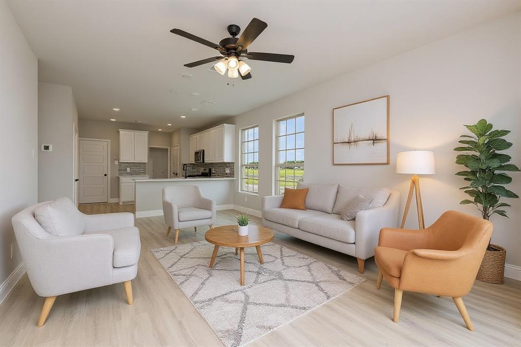 3613 Geoffrey Trail Rowlett, TX 75088 - Photo 2 of 13 Living room with light wood finished floors, recessed lighting, and ceiling fan