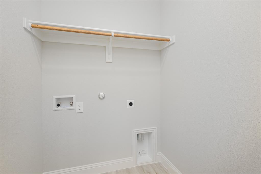 3613 Geoffrey Trail Rowlett, TX 75088 - Photo 7 of 13 Laundry room with gas dryer hookup, light wood-style floors, hookup for an electric dryer, and hookup for a washing machine