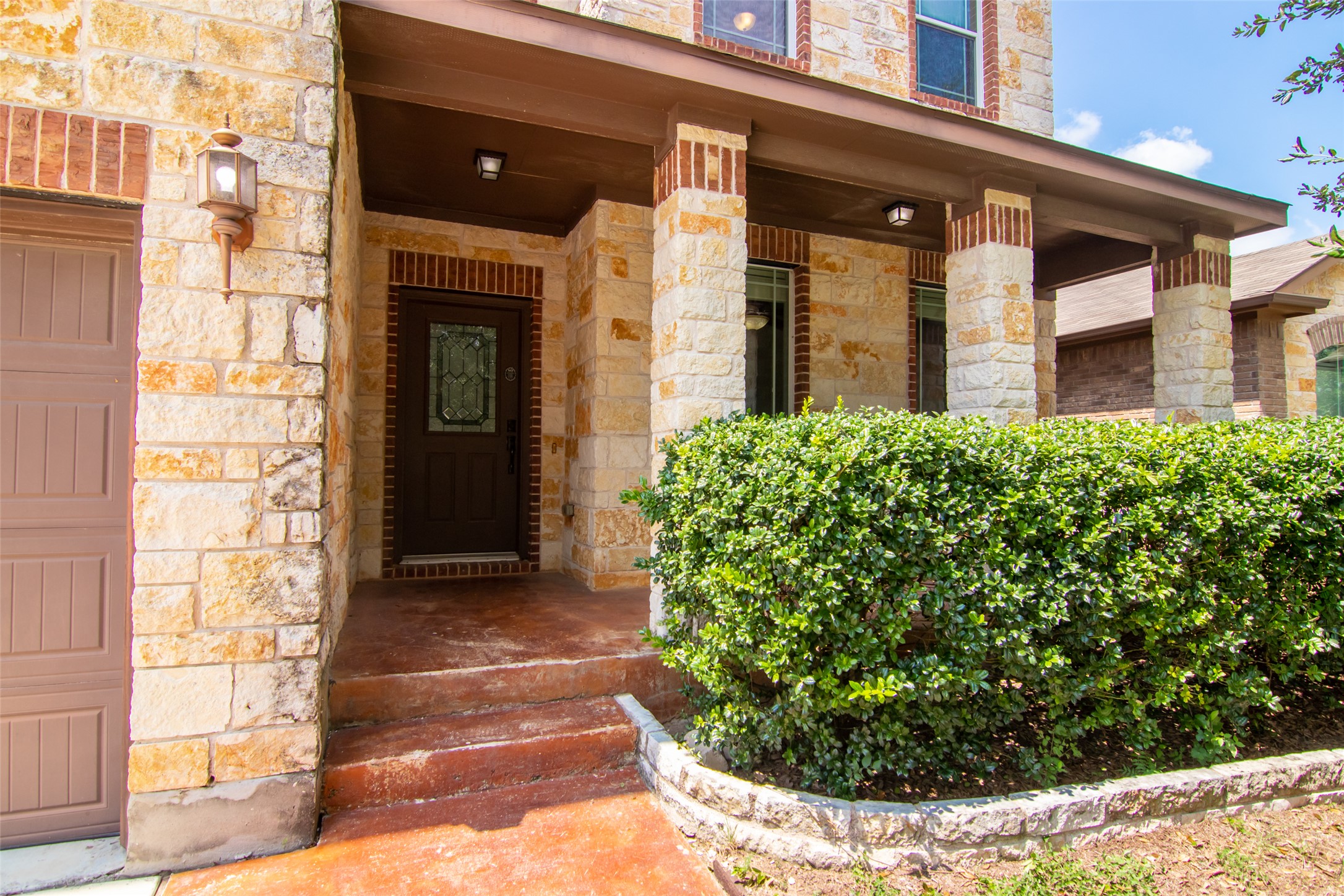 12104 Broten Street Austin, TX 78748 - Photo 3 of 32 A welcoming stone and brick facade creates inviting curb appeal.
