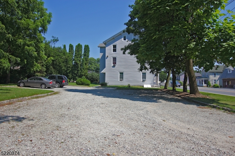 117 Main Street, Unit 1 Andover, NJ 07821 - Photo 11 of 11 a view of a house with a yard and large trees