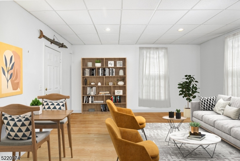 117 Main Street, Unit 1 Andover, NJ 07821 - Photo 4 of 11 a living room with furniture and wooden floor