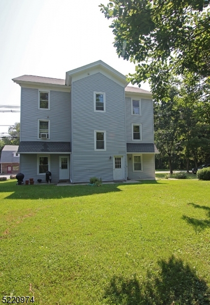 117 Main Street, Unit 1 Andover, NJ 07821 - Photo 10 of 11 a front view of house with yard and trees