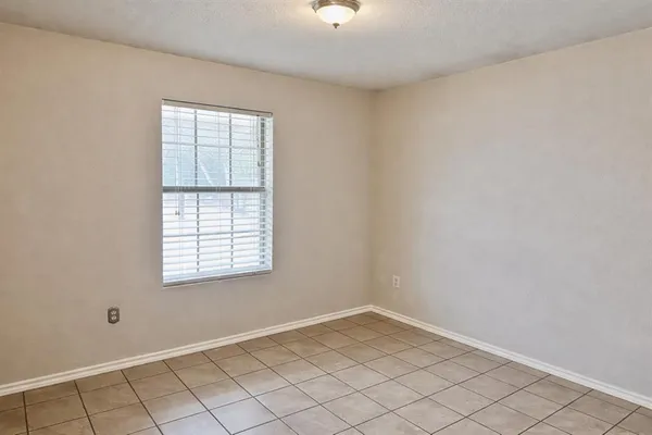 a bathroom with a sink a light fixture and a toilet