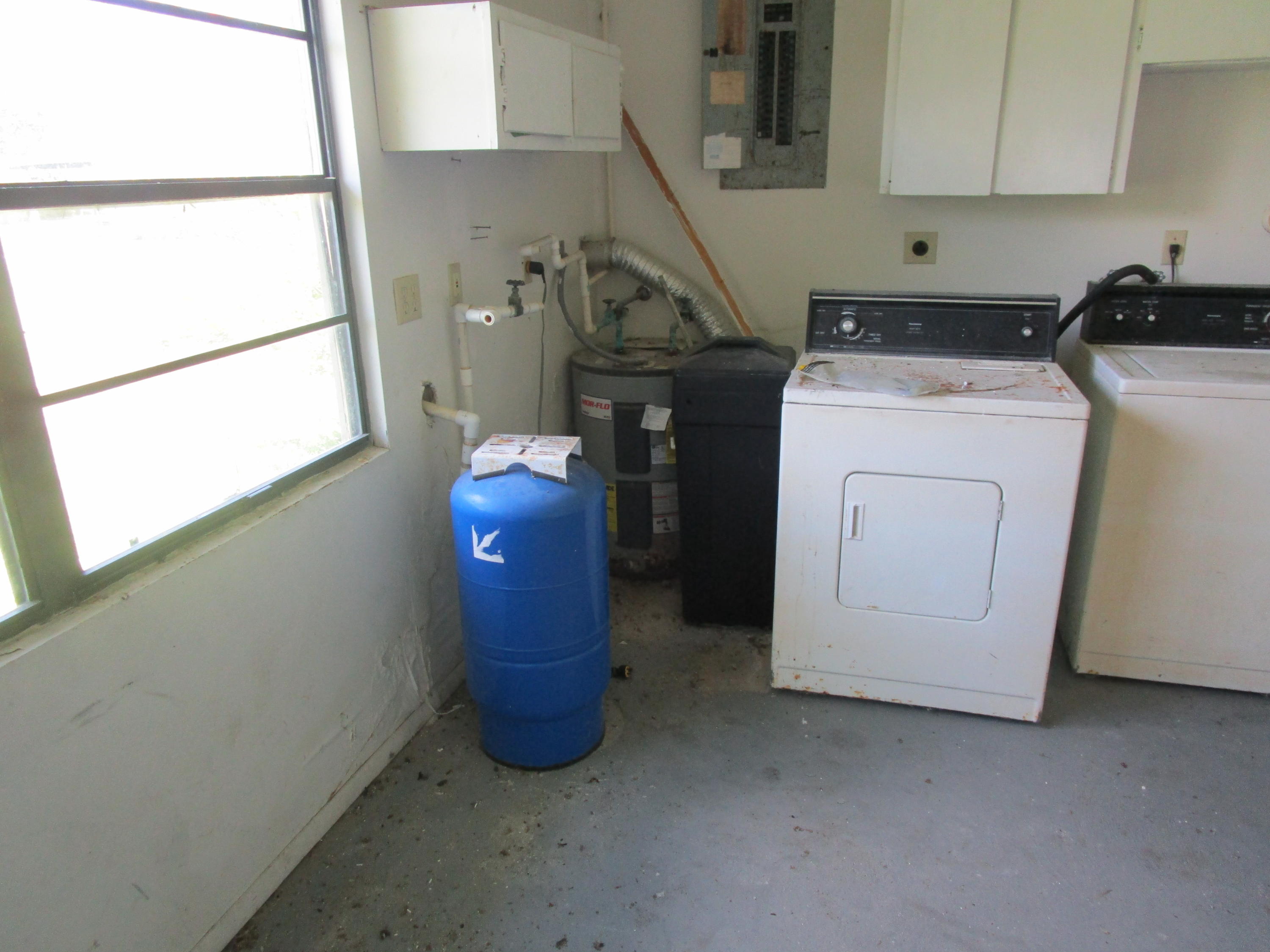 6302 Indrio Road Fort Pierce, FL 34951 - Photo 18 of 25 a utility room with dryer and washer
