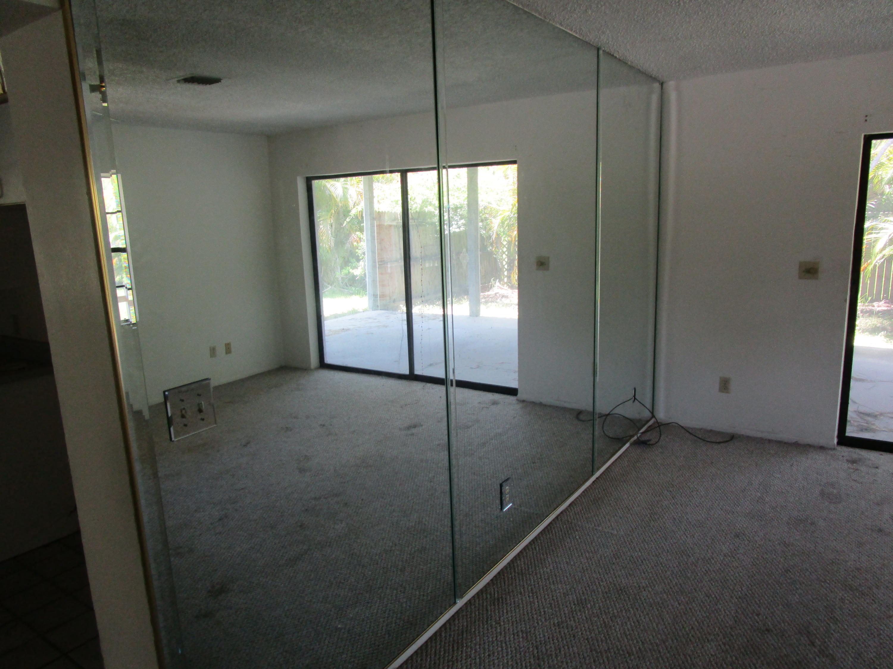 6302 Indrio Road Fort Pierce, FL 34951 - Photo 5 of 25 a view of empty room with window