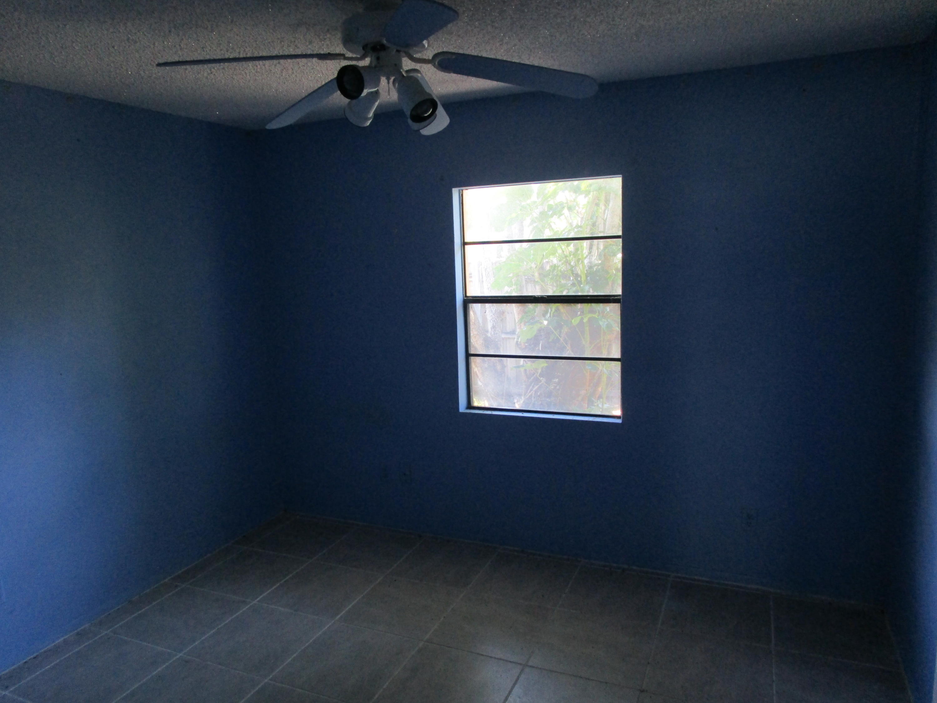 6302 Indrio Road Fort Pierce, FL 34951 - Photo 9 of 25 an empty room with a window