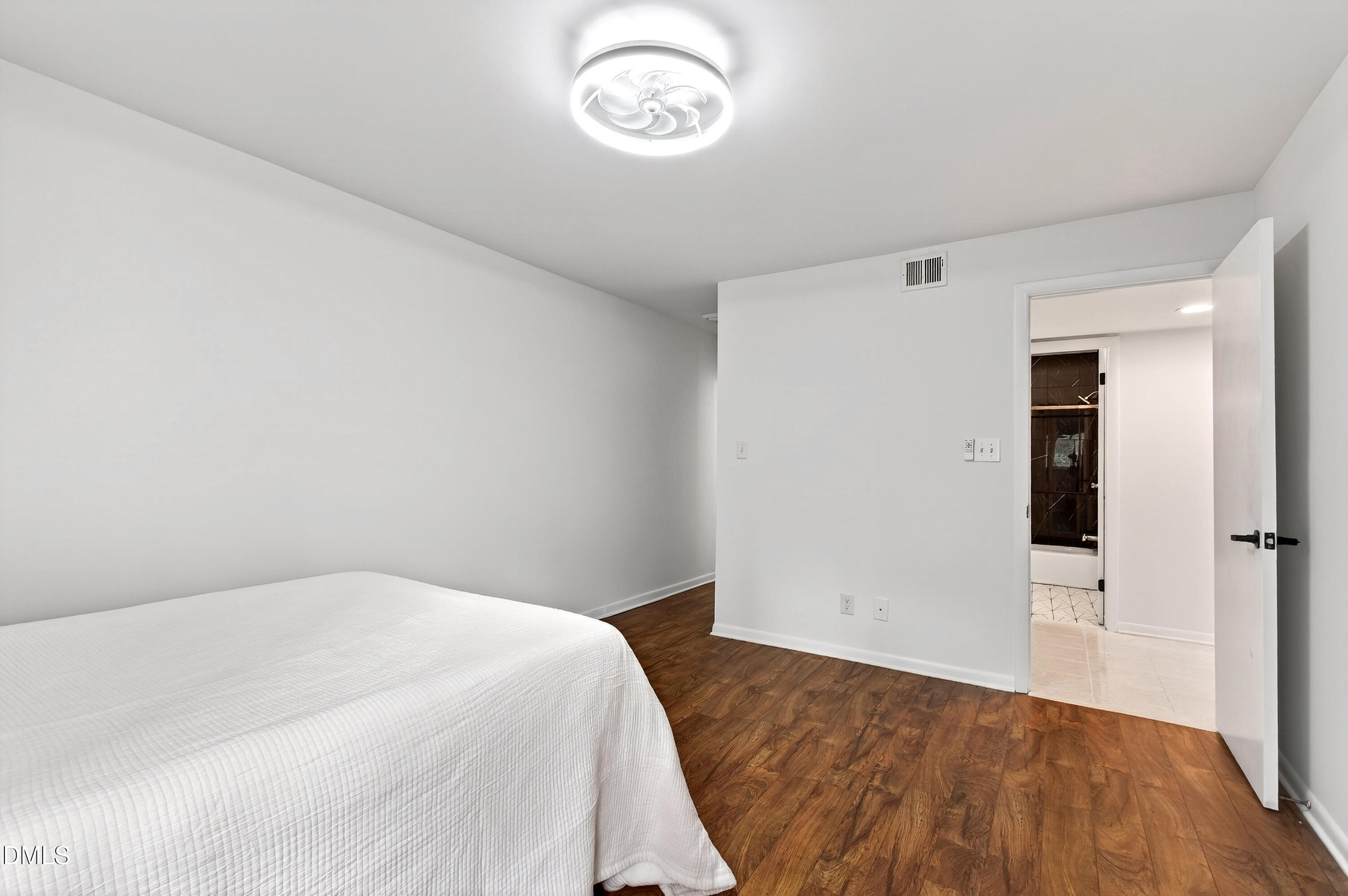 4507 Edwards Mill Road, Unit G Raleigh, NC 27612 - Photo 17 of 19 a bedroom with a bed and a window