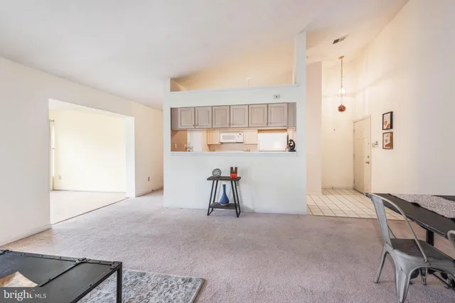 a view of kitchen with cabinets and wooden floor
