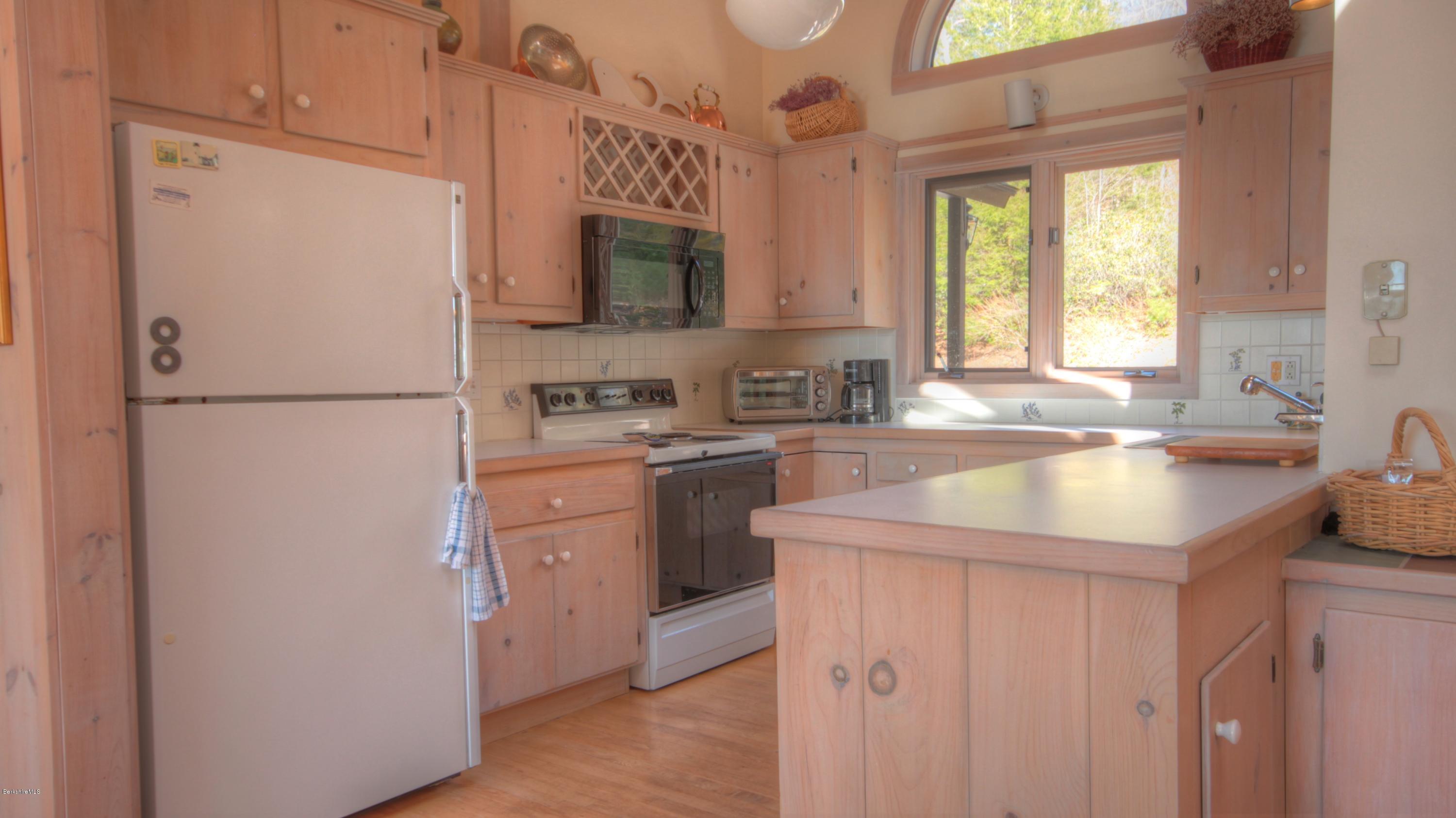 75 Laurel Hill Road Monterey, MA 01245 - Photo 13 of 25 a kitchen with a refrigerator sink and window