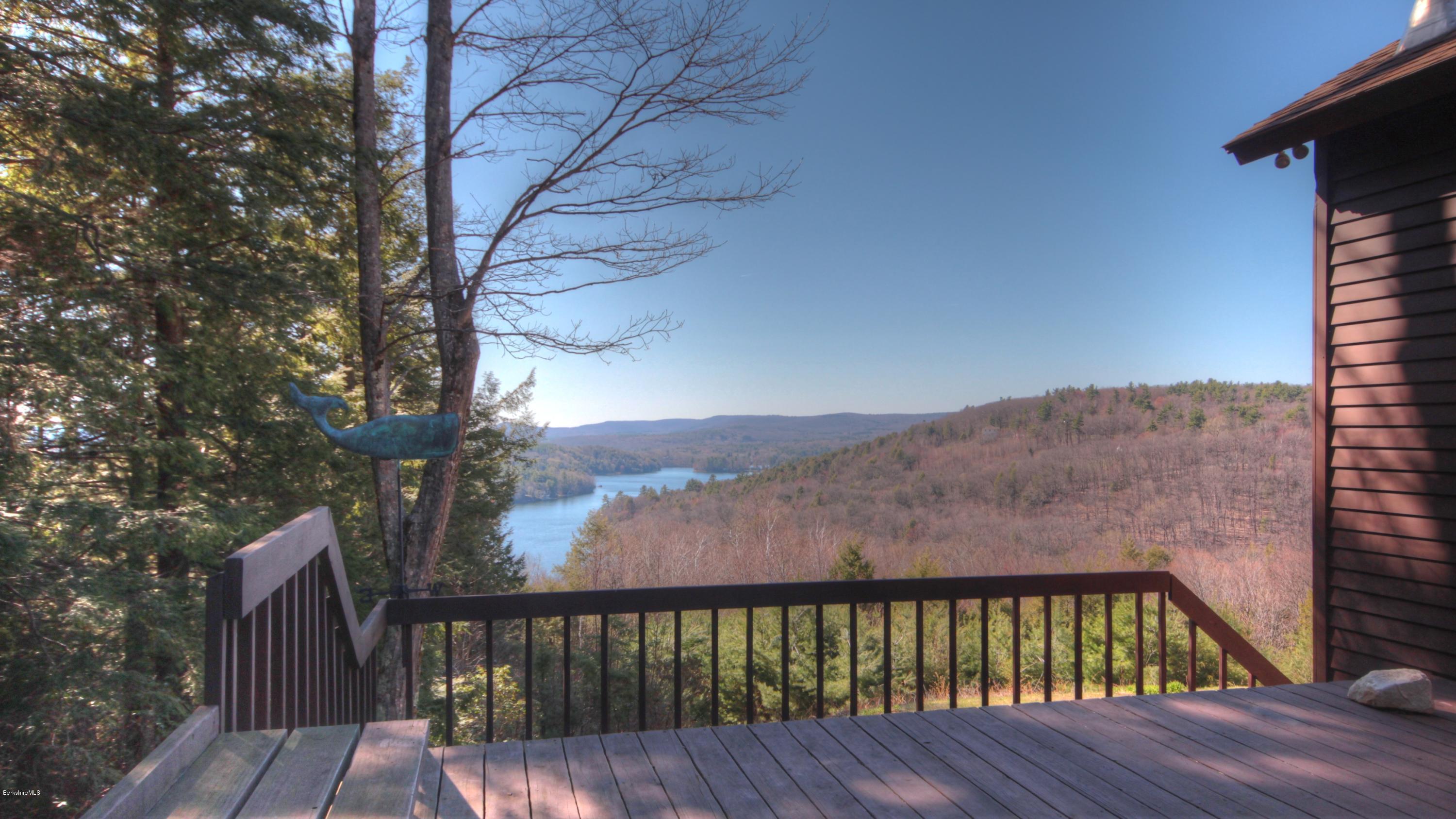 75 Laurel Hill Road Monterey, MA 01245 - Photo 17 of 25 a balcony with wooden floor and fence