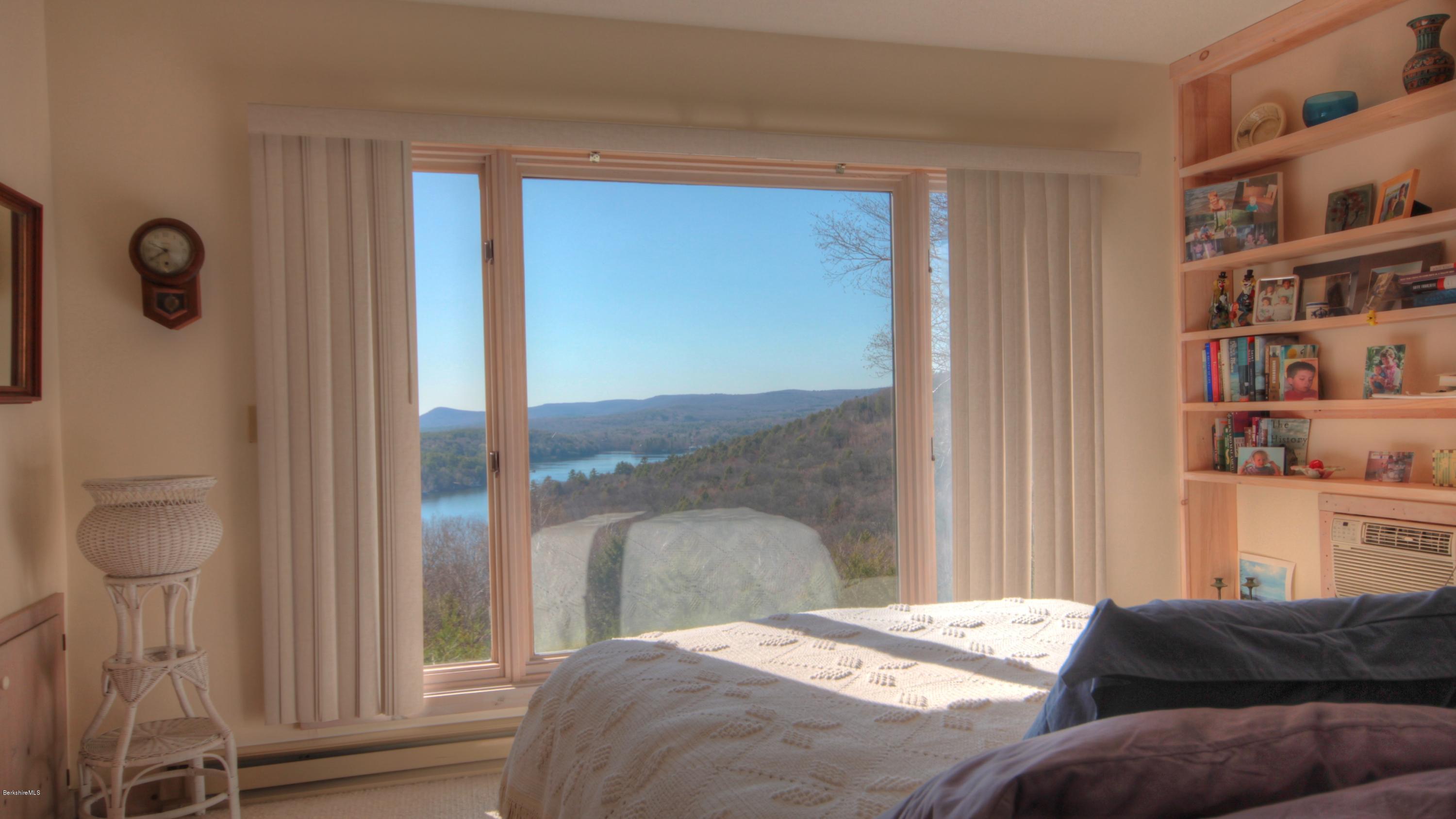 75 Laurel Hill Road Monterey, MA 01245 - Photo 18 of 25 a bedroom with a bed and a window