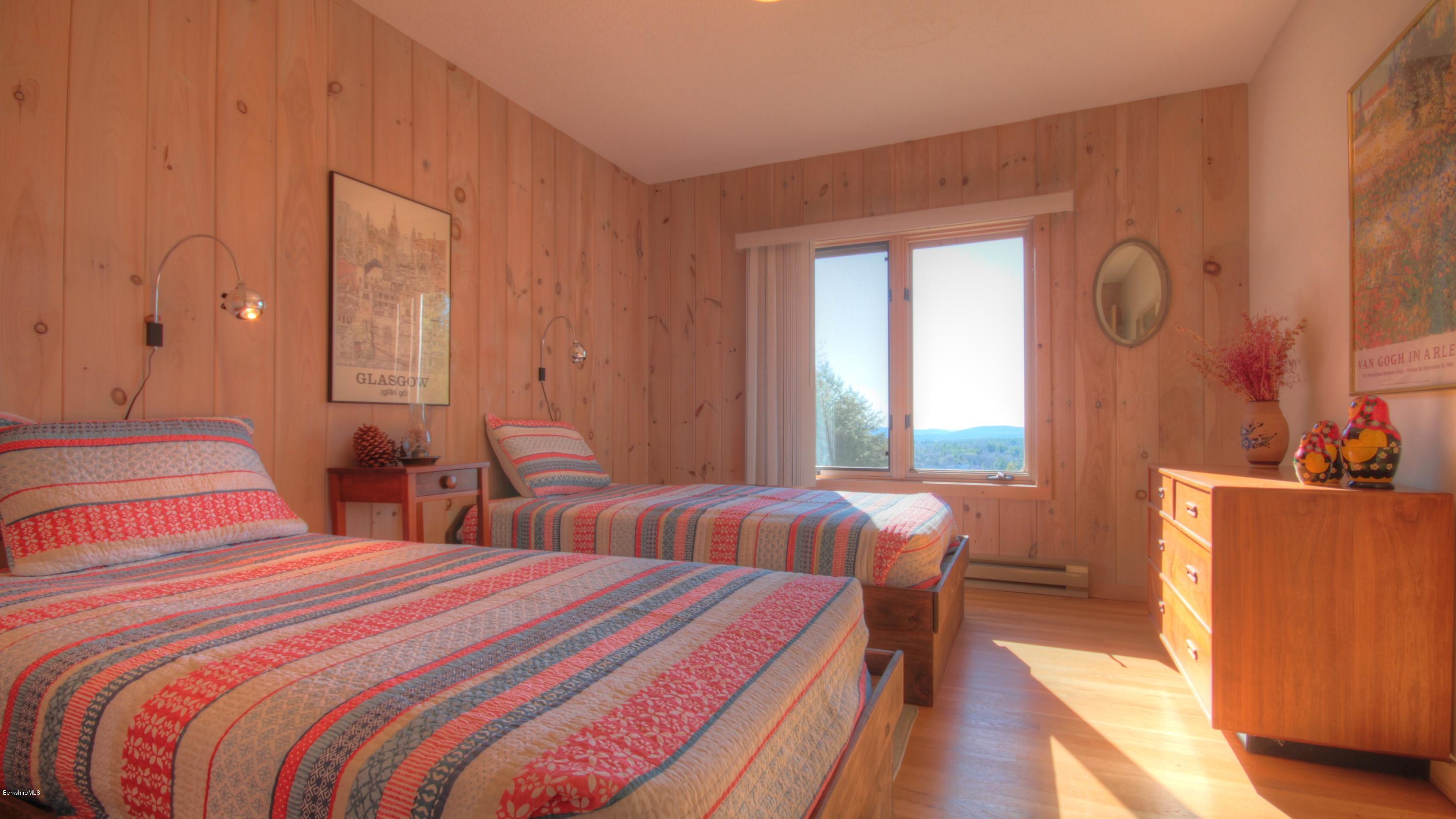 75 Laurel Hill Road Monterey, MA 01245 - Photo 20 of 25 a bedroom with two beds and next to a window