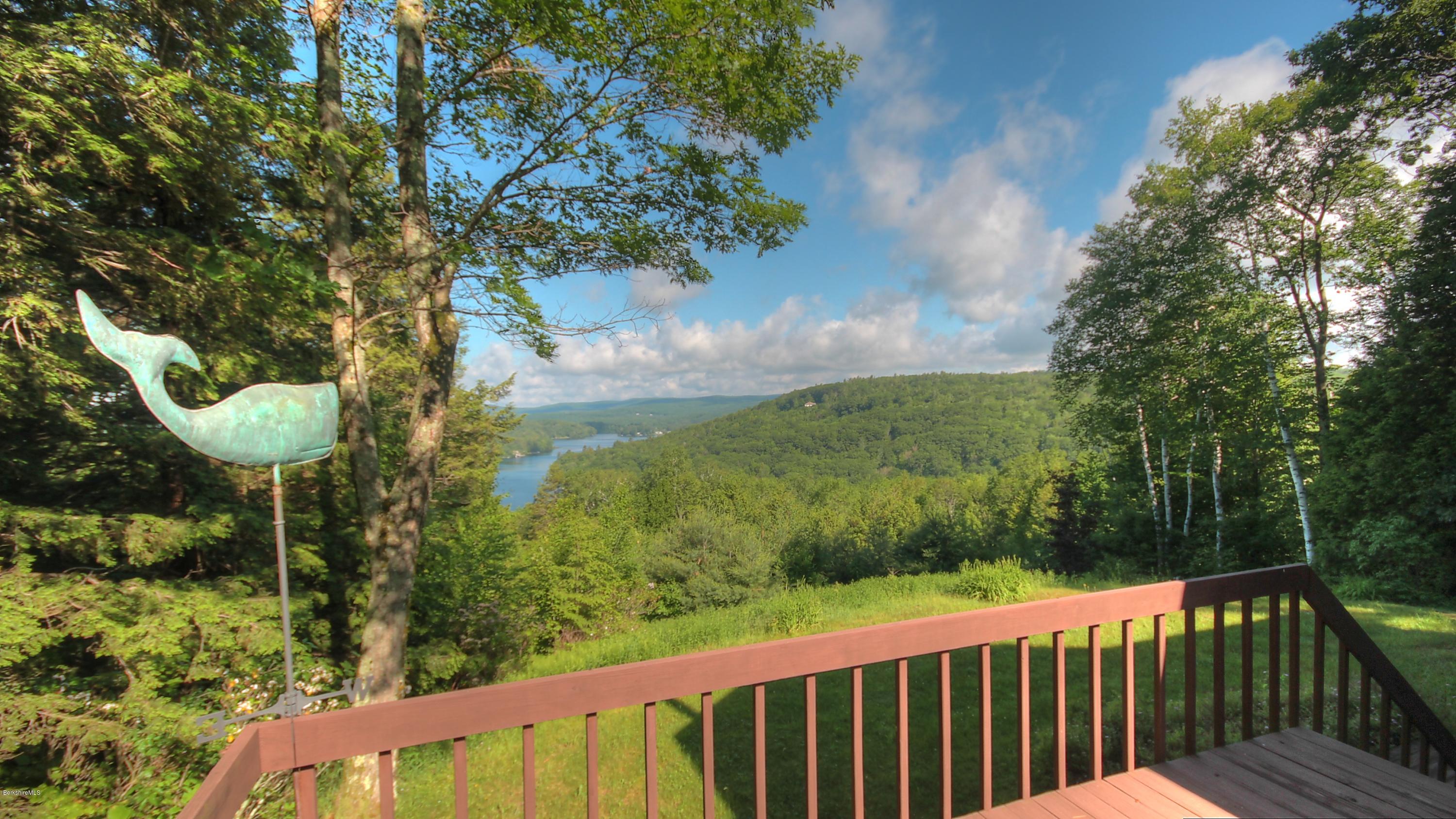 75 Laurel Hill Road Monterey, MA 01245 - Photo 3 of 25 a view of a balcony with wooden floor and fence