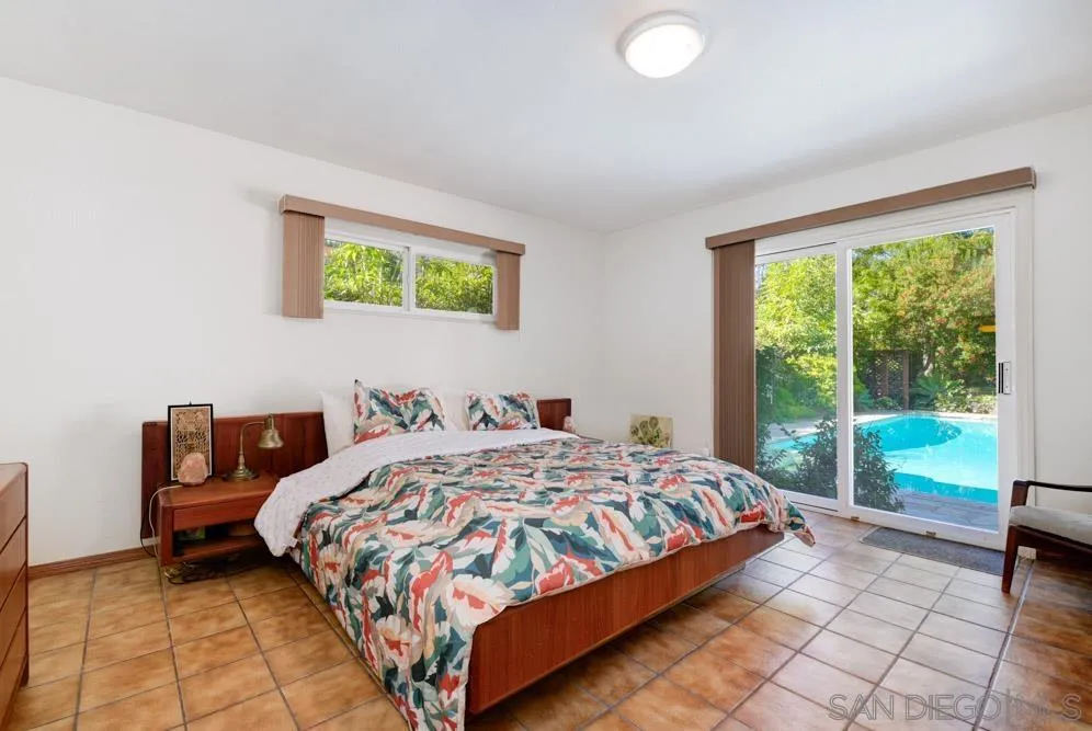 4470 Monahan Road La Mesa, CA 91941 - Photo 12 of 26 a bedroom with a bed and a large window