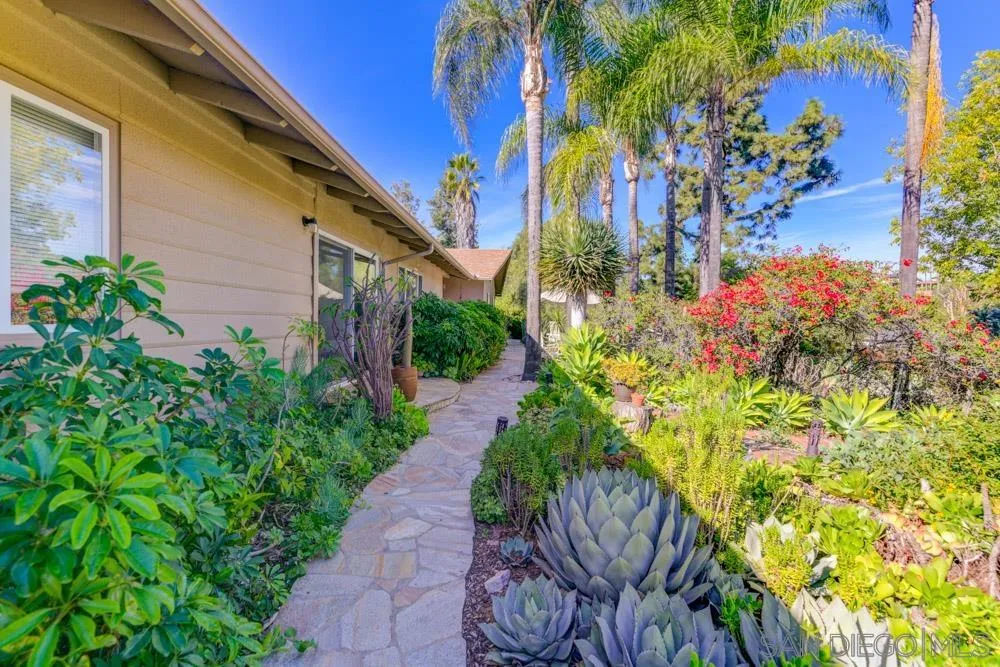 4470 Monahan Road La Mesa, CA 91941 - Photo 2 of 26 a view of a back yard with flower plants