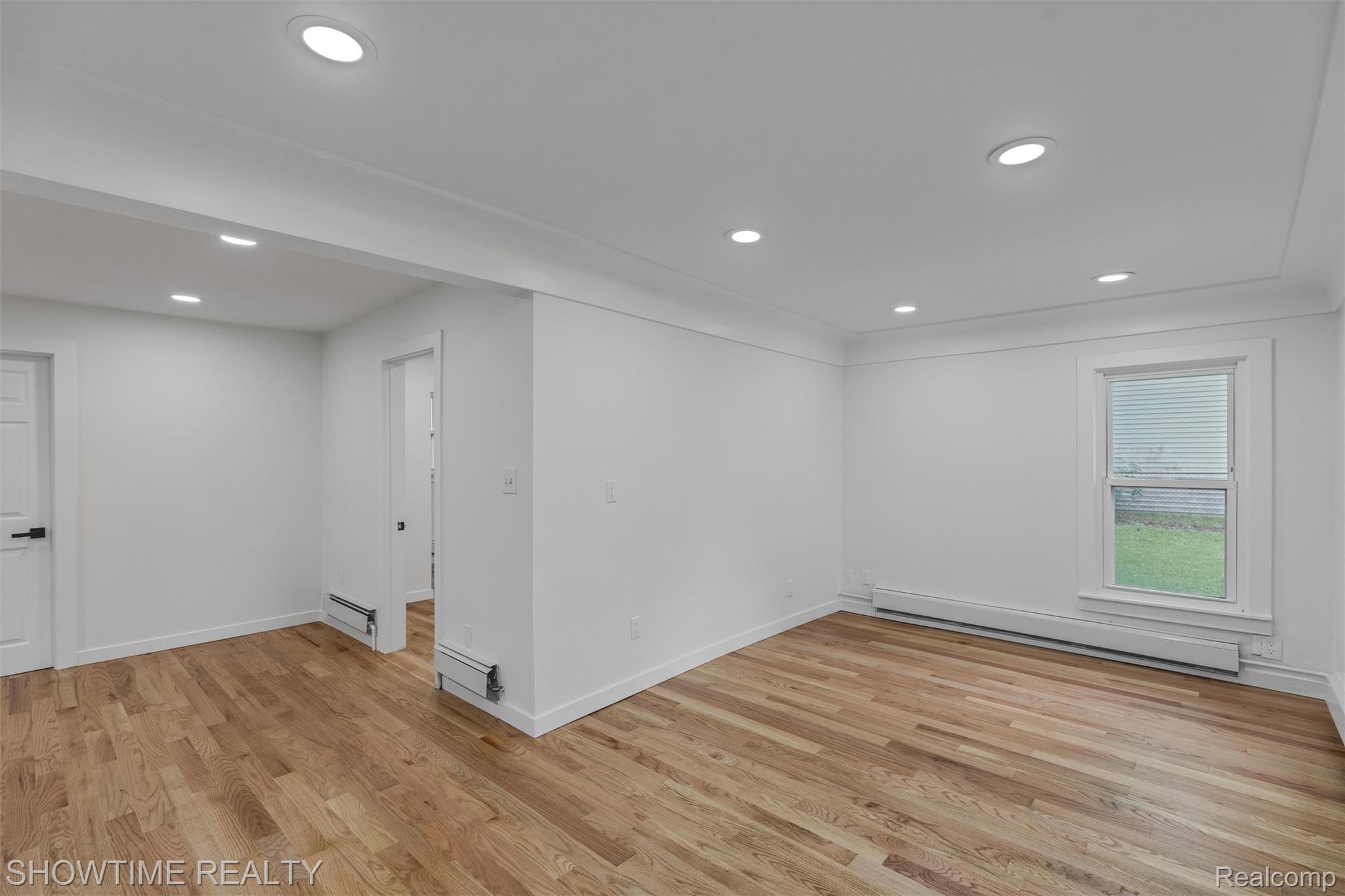 14854 East 10 Mile Road Warren, MI 48089 - Photo 8 of 24 Spacious room featuring wood-finish flooring, recessed lighting, and a single window with blinds