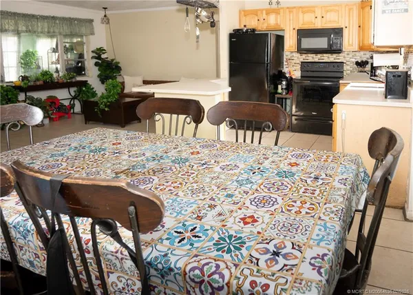 a view of a dining room with furniture and a fireplace