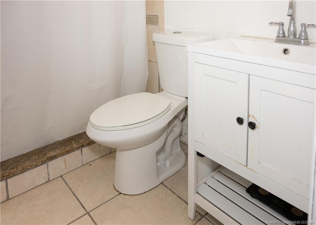 2314 Southeast Washington Street Stuart, FL 34997 - Photo 16 of 16 a bathroom with a sink and toilet