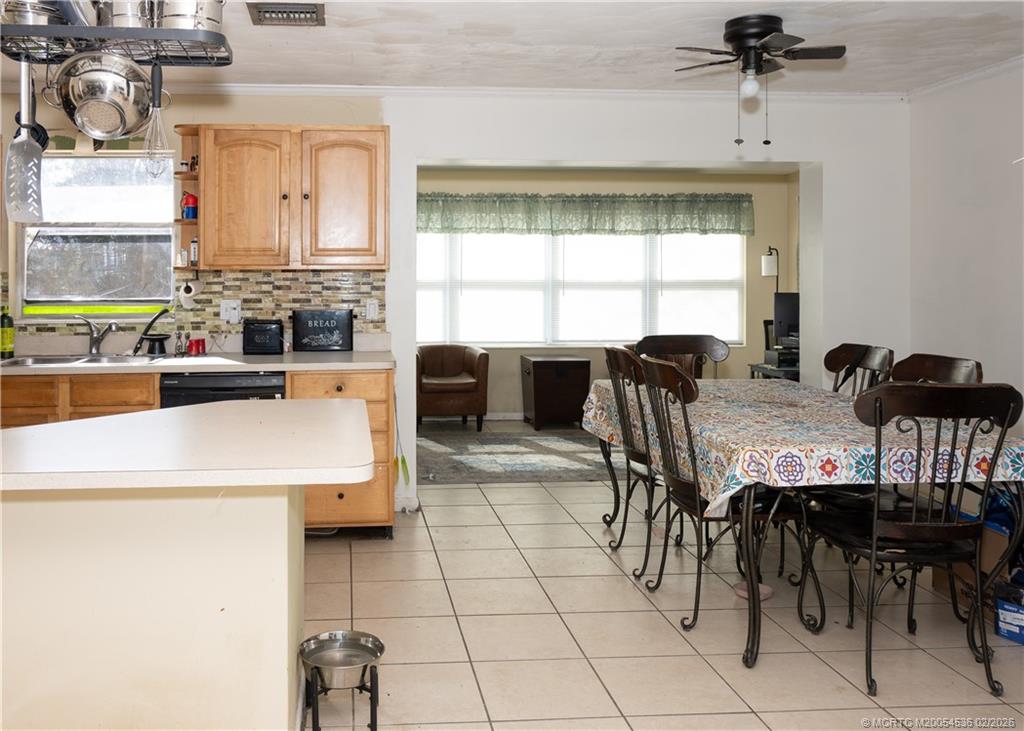 2314 Southeast Washington Street Stuart, FL 34997 - Photo 9 of 16 a view of a dining room with furniture and window