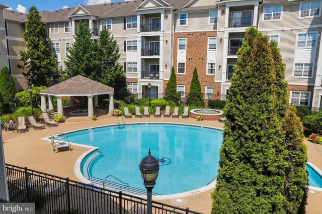 a view of pool with outdoor seating