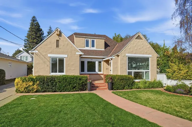 a front view of a house with a yard