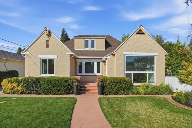a front view of a house with a yard