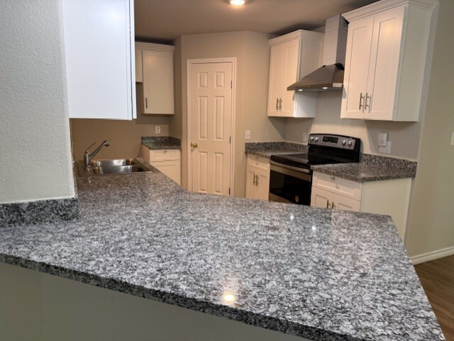 2410 Westcliff Road Killeen, TX 76543 - Photo 5 of 18 Granite counters and stainless steel appliances complete this well-appointed kitchen.