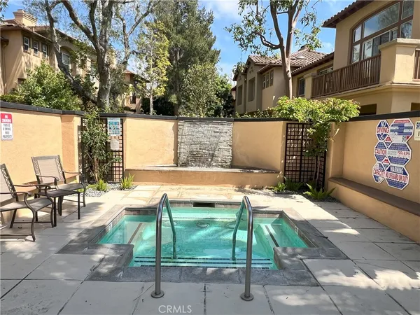 a view of backyard with outdoor seating