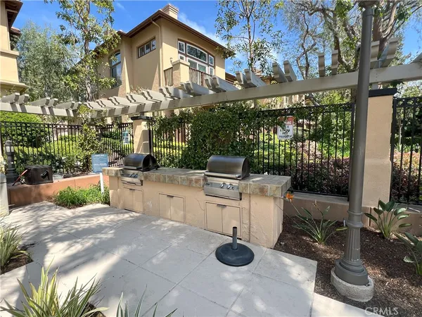 a view of a chairs and table in backyard