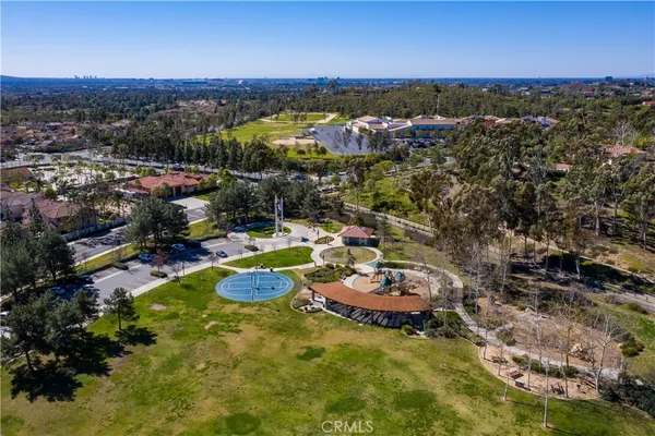 an aerial view of a house with a swimming pool yard and outdoor seating