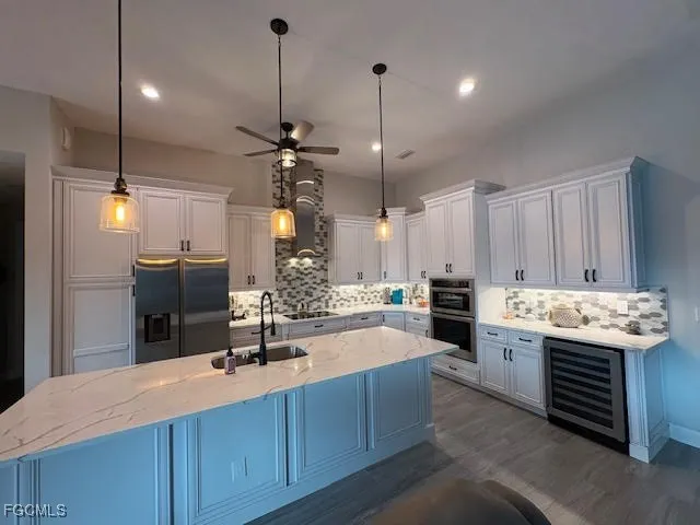 a bathroom with a sink a toilet a mirror and shower