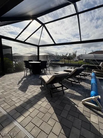 a bedroom with two beds and a chandelier