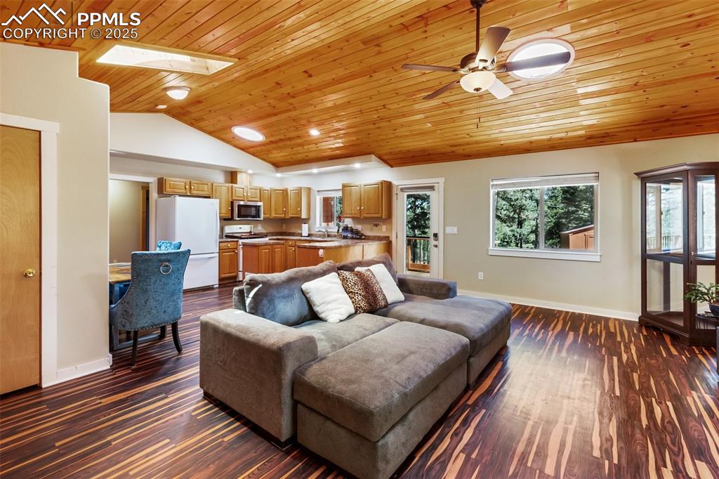 234 Wahsatch Road Florissant, CO 80816 - Photo 10 of 44 a living room with furniture and a wooden floor