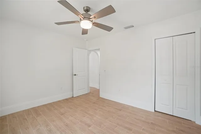 an empty room with fan