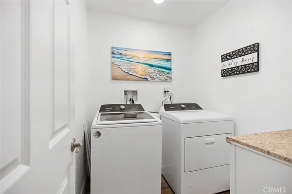 a view of storage and utility room with washer and dryer