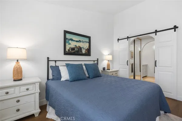 a bed room with a bed and a night stand