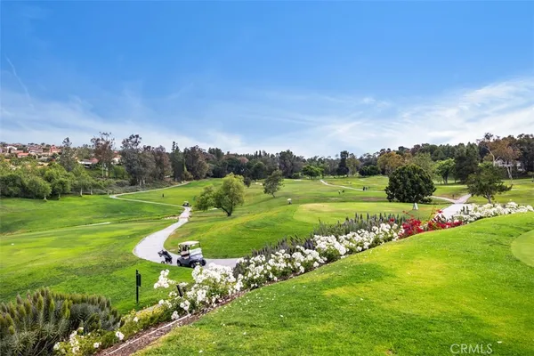 a view of a golf course with a lake
