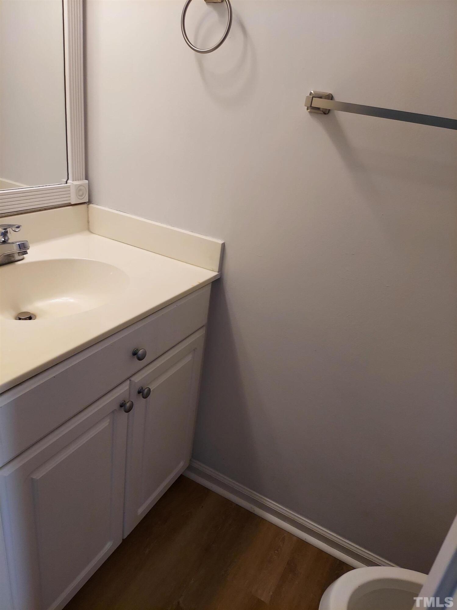 224 Crossfire Road Holly Springs, NC 27540 - Photo 12 of 43 a bathroom with a sink and cabinets
