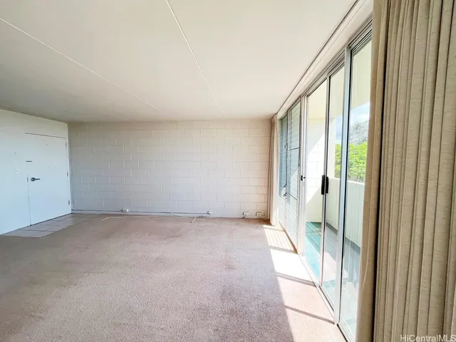 a view of an empty room and window