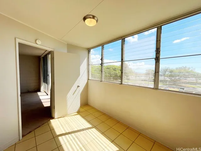 a view of a room with a furniture and floor to ceiling window